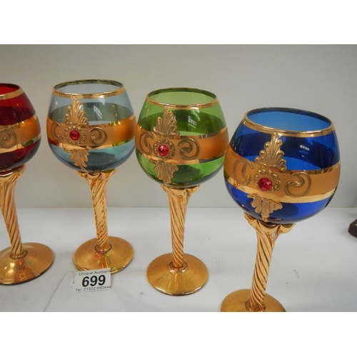 699 - A set of 6 Bohemian coloured glasses with gilding (in good condition).