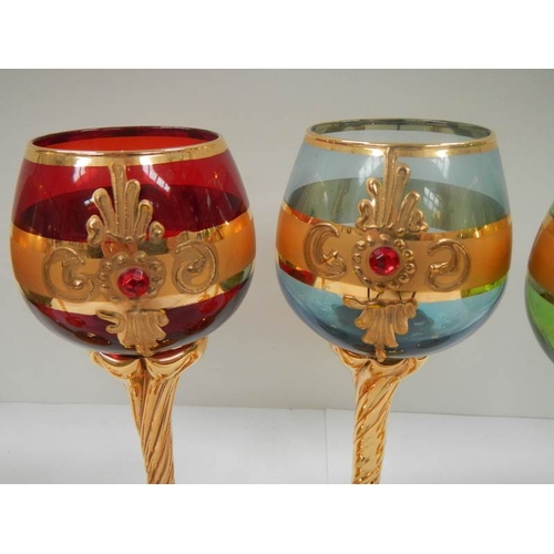 699 - A set of 6 Bohemian coloured glasses with gilding (in good condition).