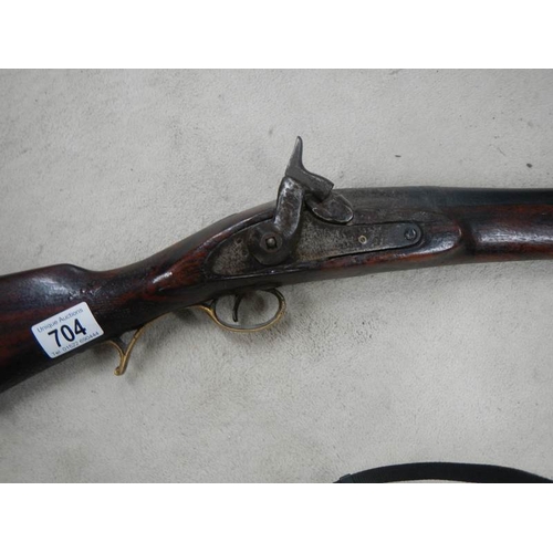 704 - An original percussion rifle in good condition.