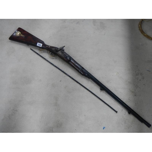 704 - An original percussion rifle in good condition.