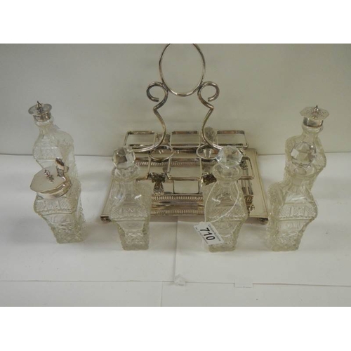 710 - A good silver plate 6 bottle cruet.