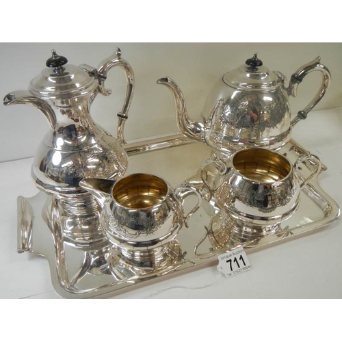 711 - A good quality silver plate 4 piece tea set on a silver plate tray.