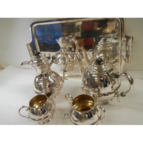 711 - A good quality silver plate 4 piece tea set on a silver plate tray.