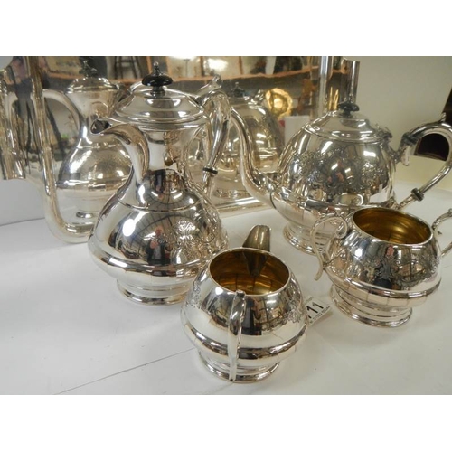 711 - A good quality silver plate 4 piece tea set on a silver plate tray.