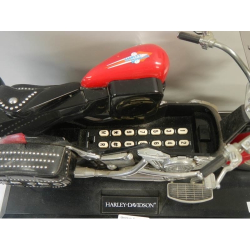 715 - 4 good model motor cycles including Harley Davidson.