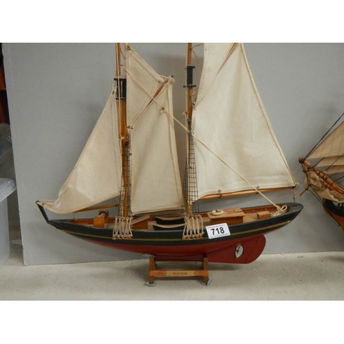 718 - A model sailing ship and a model Man o' war ship.