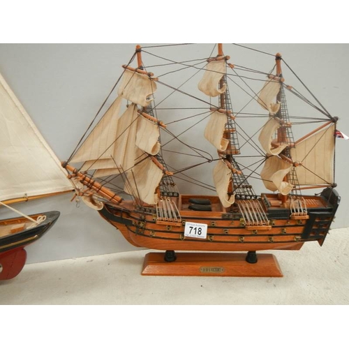 718 - A model sailing ship and a model Man o' war ship.