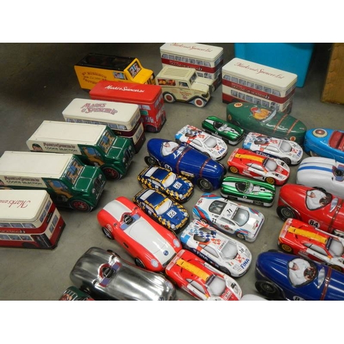 735 - 2 boxes of biscuit and sweet vehicle tins including buses and cars.