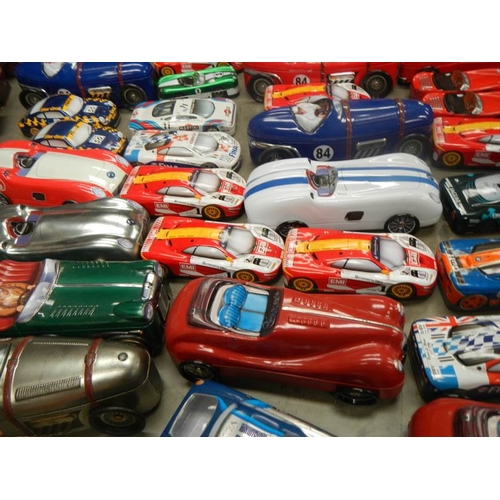 735 - 2 boxes of biscuit and sweet vehicle tins including buses and cars.