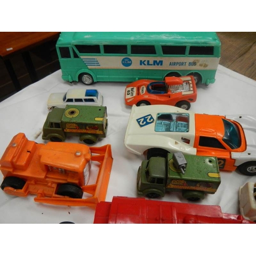 743 - A box of plastic and metal toy vehicles.