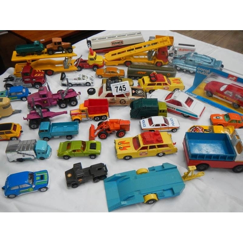 745 - A box containing various die cast toys including Matchbox and Corgi.