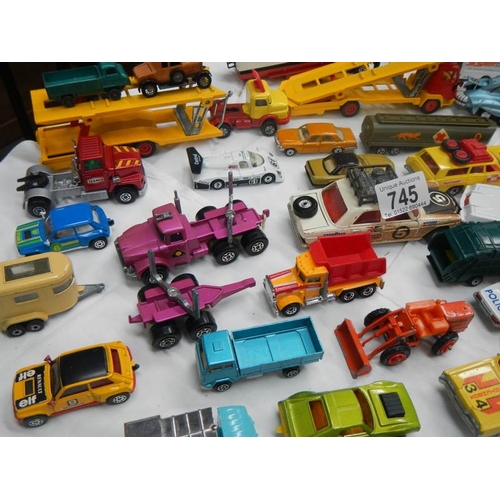 745 - A box containing various die cast toys including Matchbox and Corgi.