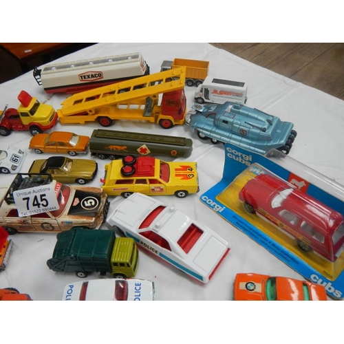 745 - A box containing various die cast toys including Matchbox and Corgi.