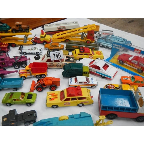 745 - A box containing various die cast toys including Matchbox and Corgi.