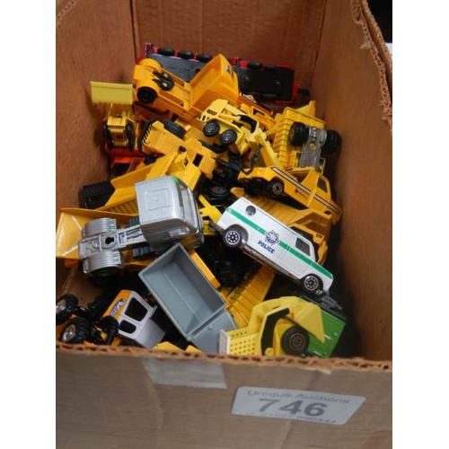 746 - A box containing various die cast dumper truck and truck models.