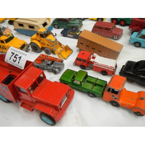 751 - A box containing various die cat models including Lesney, Matchbox, Corgi and Dinky.