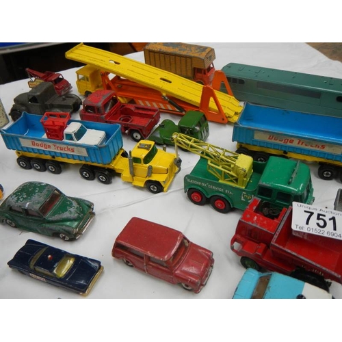 751 - A box containing various die cat models including Lesney, Matchbox, Corgi and Dinky.