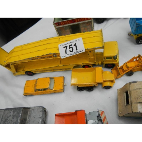 751 - A box containing various die cat models including Lesney, Matchbox, Corgi and Dinky.