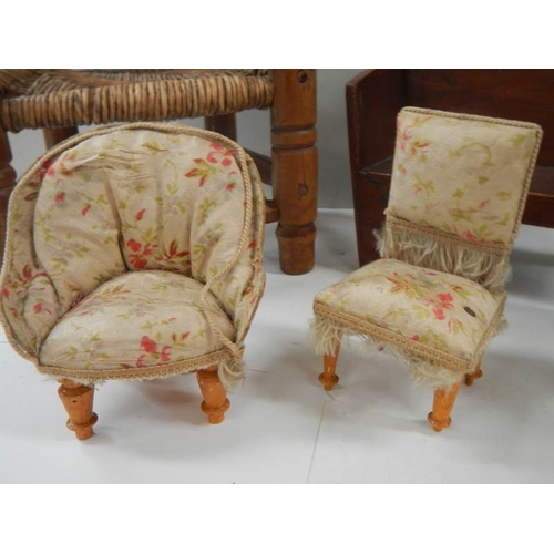 763 - A mixed lot of Victorian and later dolls furniture including chair, monks bench, Windsor style chair... 