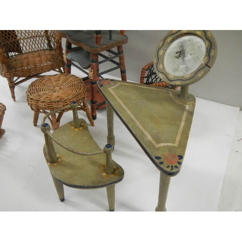 765 - A mixed lot of vintage dolls house furniture including French dressing table and stool.