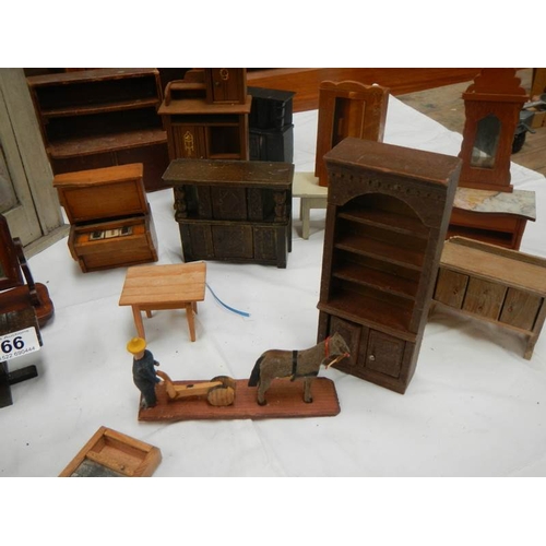 766 - A mixed lot of dolls house furniture.