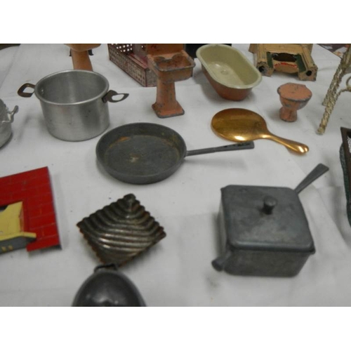 767 - A mixed lot of dolls house items including cooking utensils.