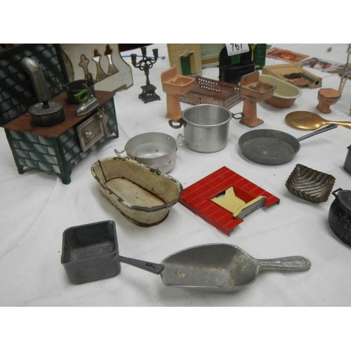 767 - A mixed lot of dolls house items including cooking utensils.