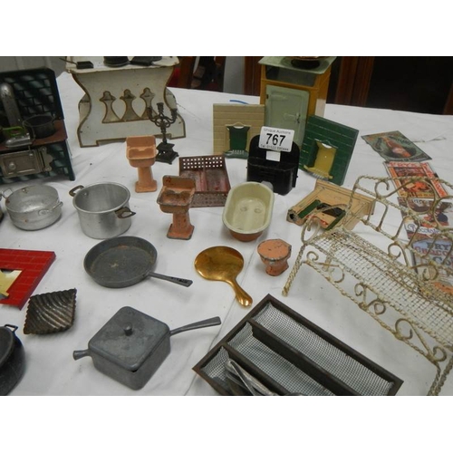 767 - A mixed lot of dolls house items including cooking utensils.