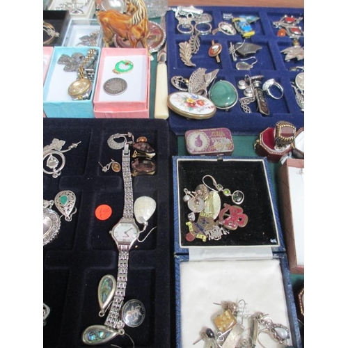 638 - A display case containing in excess of 100 pieces of mainly silver jewellery including earrings, pen... 