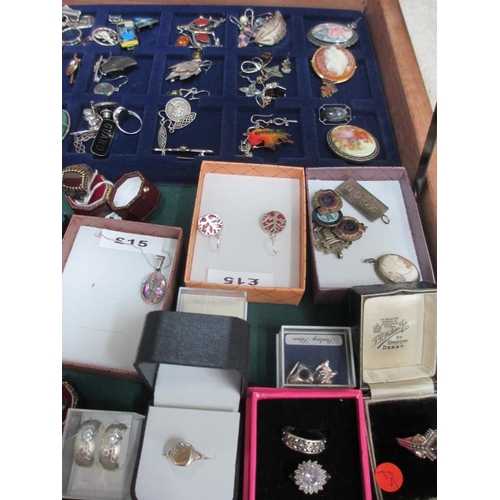 638 - A display case containing in excess of 100 pieces of mainly silver jewellery including earrings, pen... 