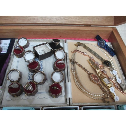 641 - A display case of approximately 40 pieces of mainly silver jewellery including pendants, rings, earr... 