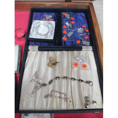 644 - A display case of silver bangles, charms, earrings etc., (this lot is buyer collect only).