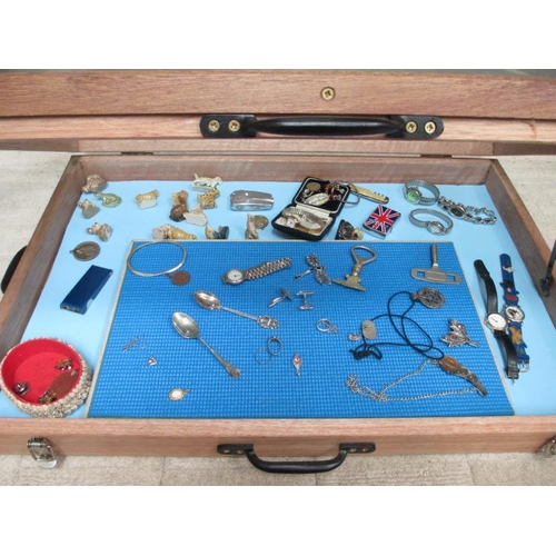 645 - A display case of miscellaneous items including watches, jewellery, Wade Whimsies etc., (this lot is... 