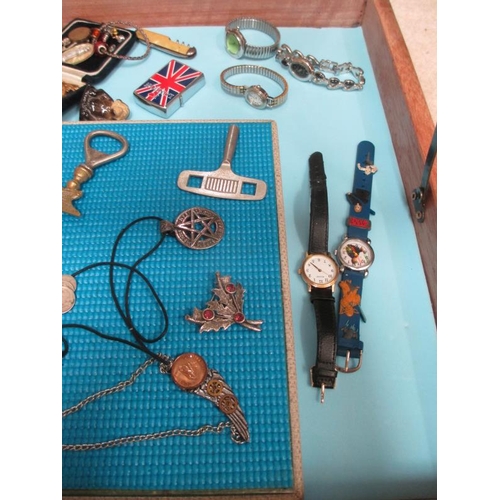 645 - A display case of miscellaneous items including watches, jewellery, Wade Whimsies etc., (this lot is... 