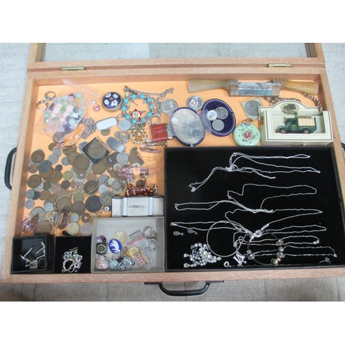 648 - A display case containing assorted coins, silver pendants and other jewellery etc., (this lot is buy... 