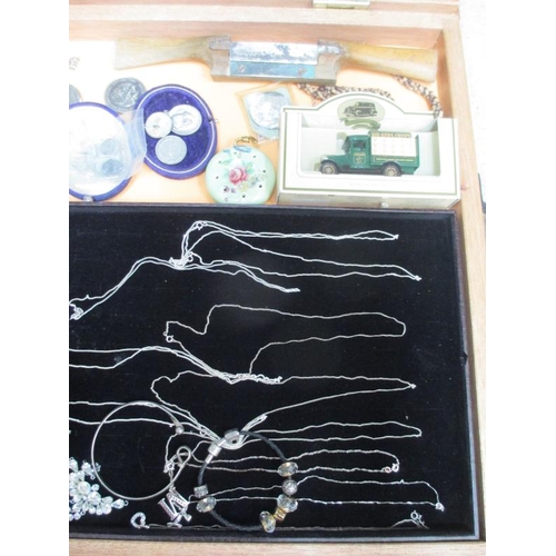 648 - A display case containing assorted coins, silver pendants and other jewellery etc., (this lot is buy... 