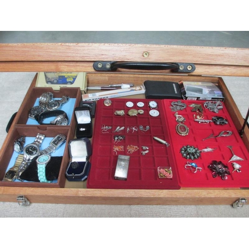 649 - A display case containing assorted jewellery and watches etc., (this lot is buyer collect only).