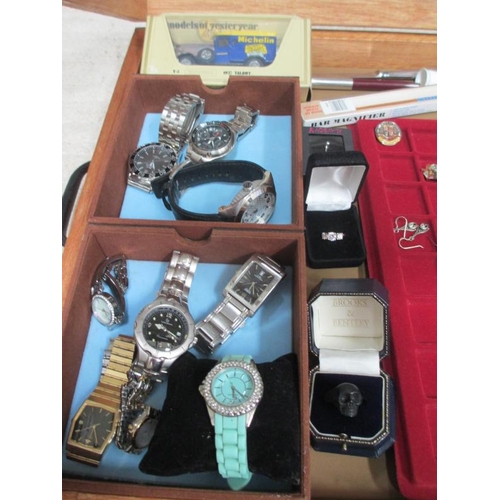 649 - A display case containing assorted jewellery and watches etc., (this lot is buyer collect only).