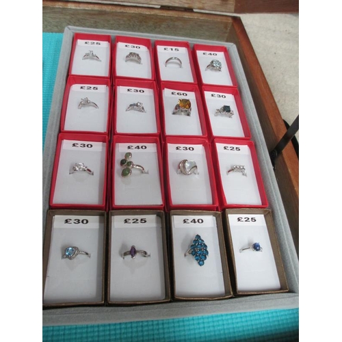 650 - A display case containing in excess of 50 silver rings and 2 gent's wrist watches. (this lot is buye... 