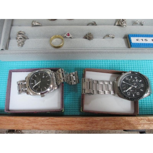 650 - A display case containing in excess of 50 silver rings and 2 gent's wrist watches. (this lot is buye... 