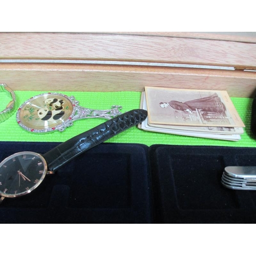 651 - A display case containing assorted watches and jewellery etc., (this lot is buyer collect only).