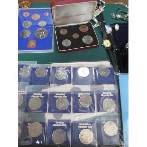 655 - A display case containing miscellaneous coins, watches, medals etc.,