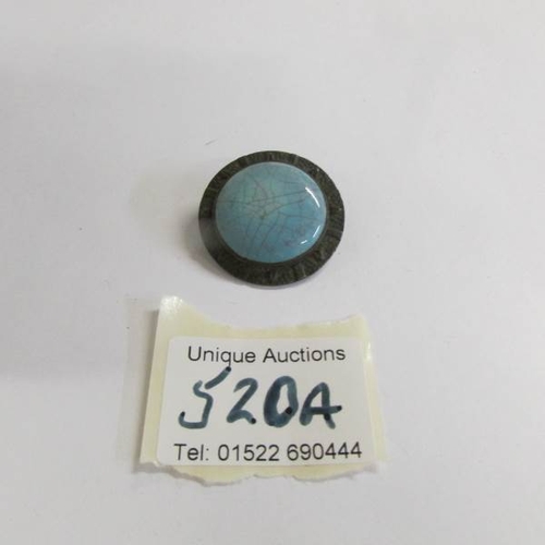 520A - A turquoise art deco brooch inscribed on back 'Ruskin'.