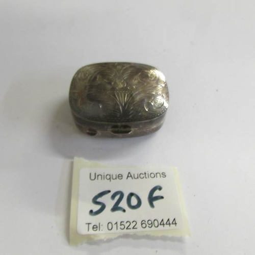 520F - An engraved silver pill box.