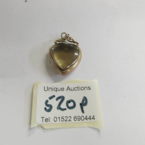 520P - A 9ct see through heart locket, 6.4 grams.