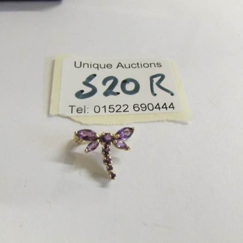 520R - A gold and amethyst dragon fly brooch.