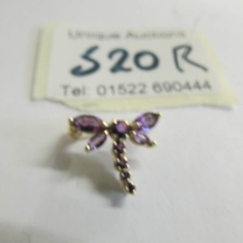 520R - A gold and amethyst dragon fly brooch.