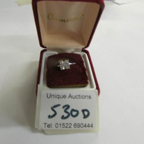 530D - An 18ct baguette and brilliant white gold ring, size I.