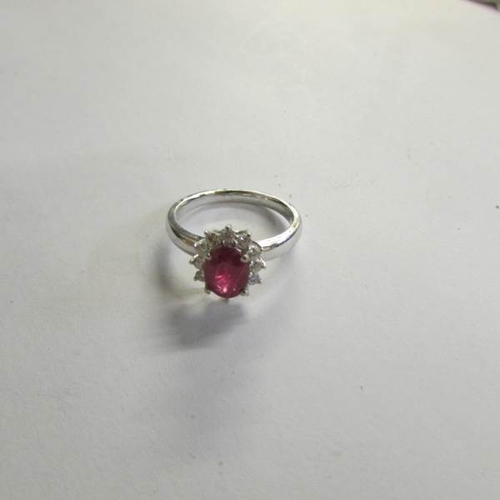 530P - An 18ct gold ruby and diamond ring (Ruby 125, diamond 70pt) size M half.