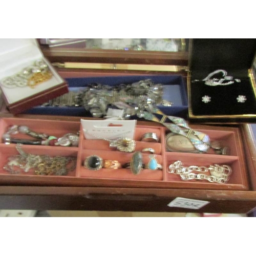 530R - A jewellery box and contents to include pendants, bracelets, rings etc.,